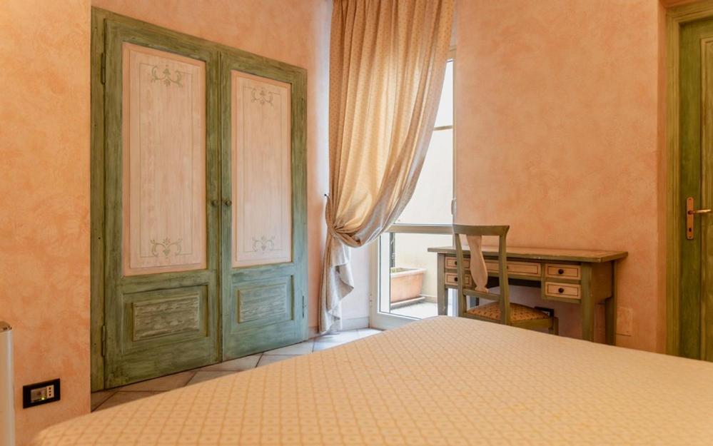 Postel nebo postele na pokoji v ubytování Hotel Rossi