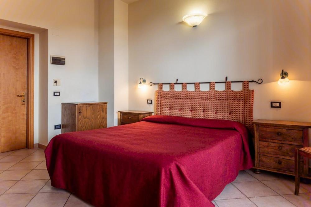 Postel nebo postele na pokoji v ubytování Hotel Rossi