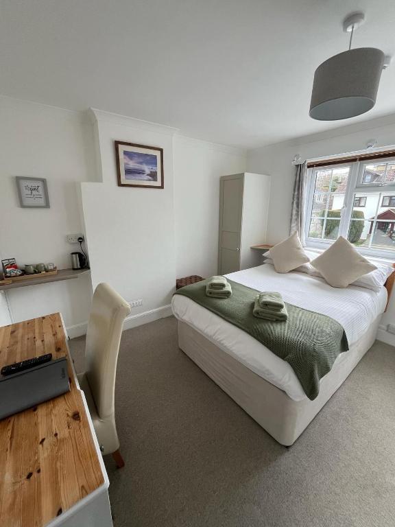 Postel nebo postele na pokoji v ubytování Lucerne B&B