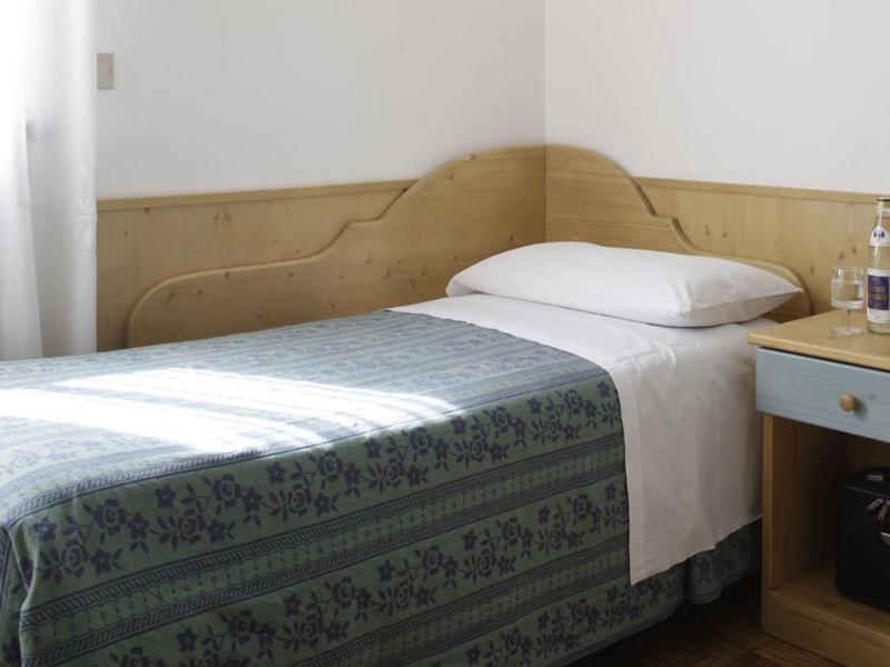 Postel nebo postele na pokoji v ubytování Albergo Miravalle-Tre Cime Views