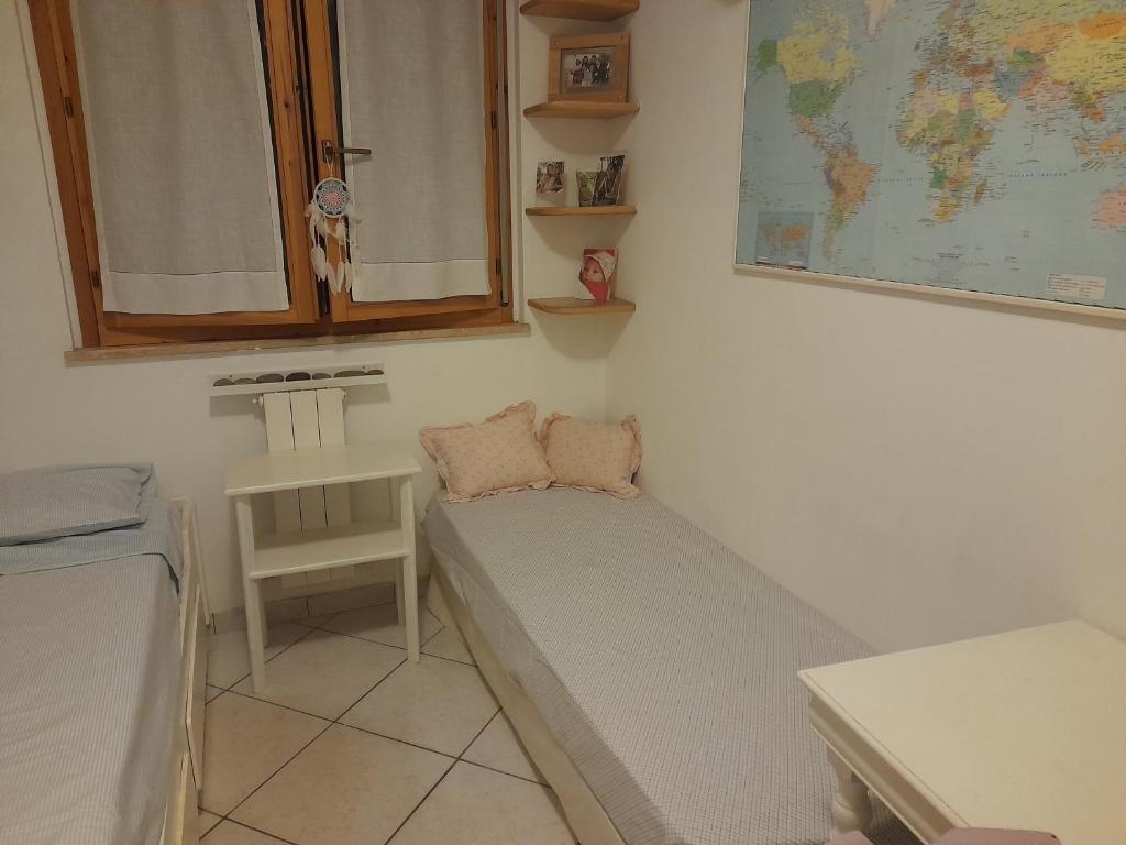 Postel nebo postele na pokoji v ubytování Casa dei glicini