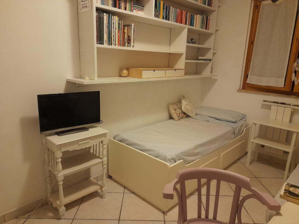 Postel nebo postele na pokoji v ubytování Casa dei glicini
