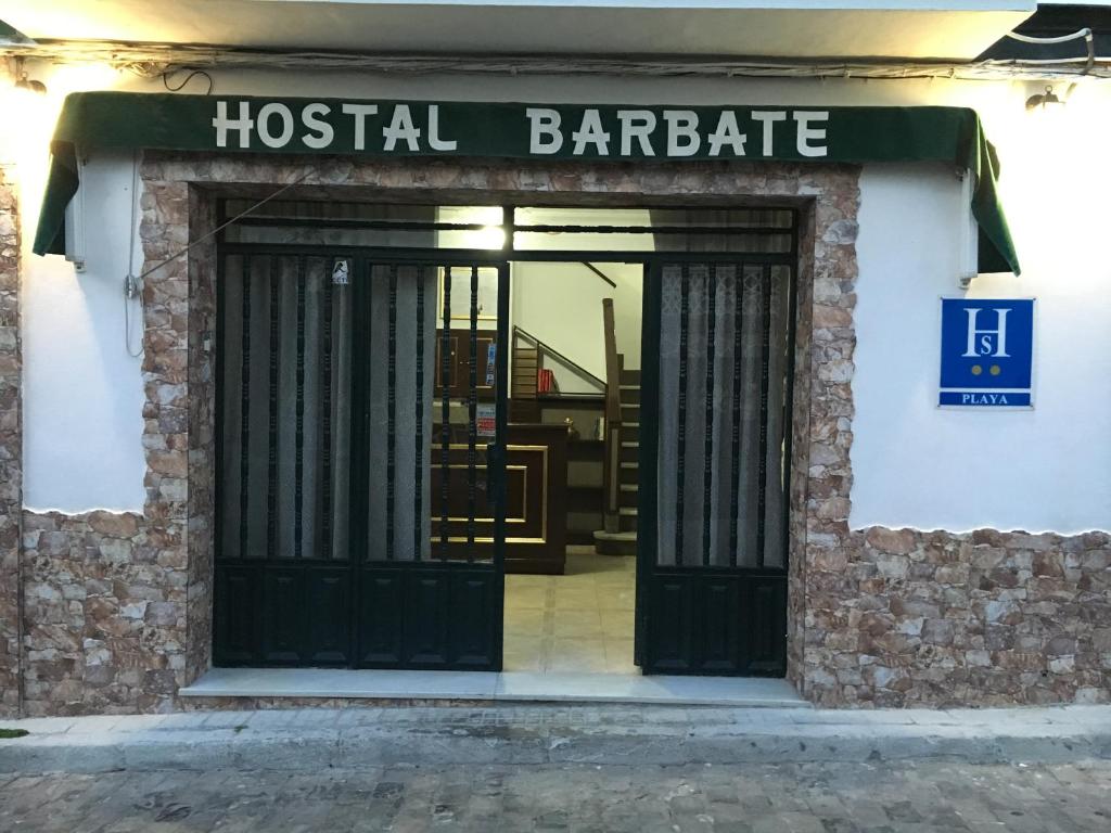 an entrance to a hostel barbara with a sign on it at Hostal Barbate in Barbate