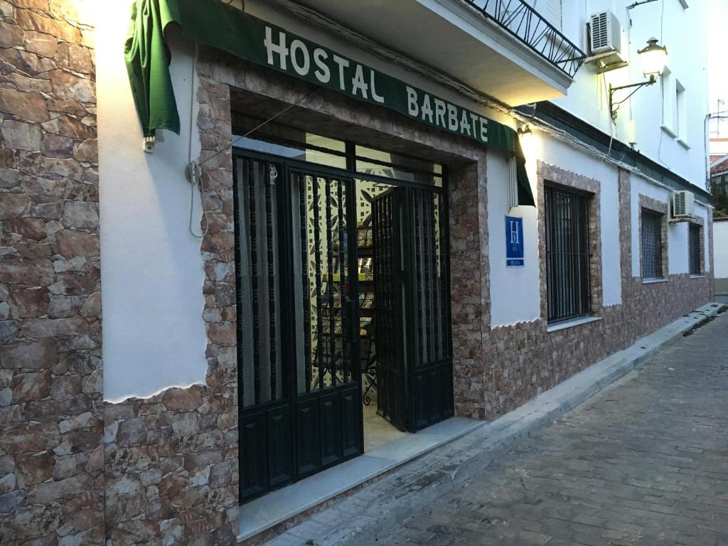 a front door of a hostel barber shop at Hostal Barbate in Barbate