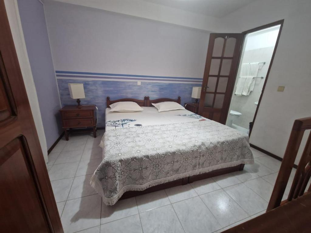 Postel nebo postele na pokoji v ubytování Residencial Raiar