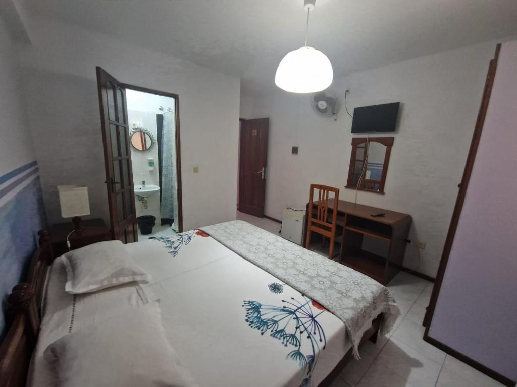 Postel nebo postele na pokoji v ubytování Residencial Raiar