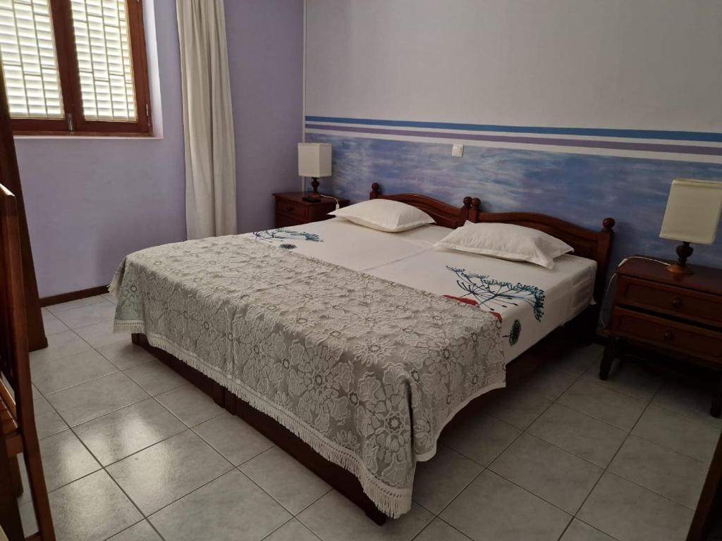 Postel nebo postele na pokoji v ubytování Residencial Raiar