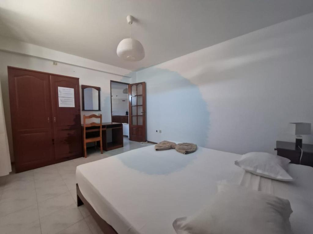 Postel nebo postele na pokoji v ubytování Residencial Raiar