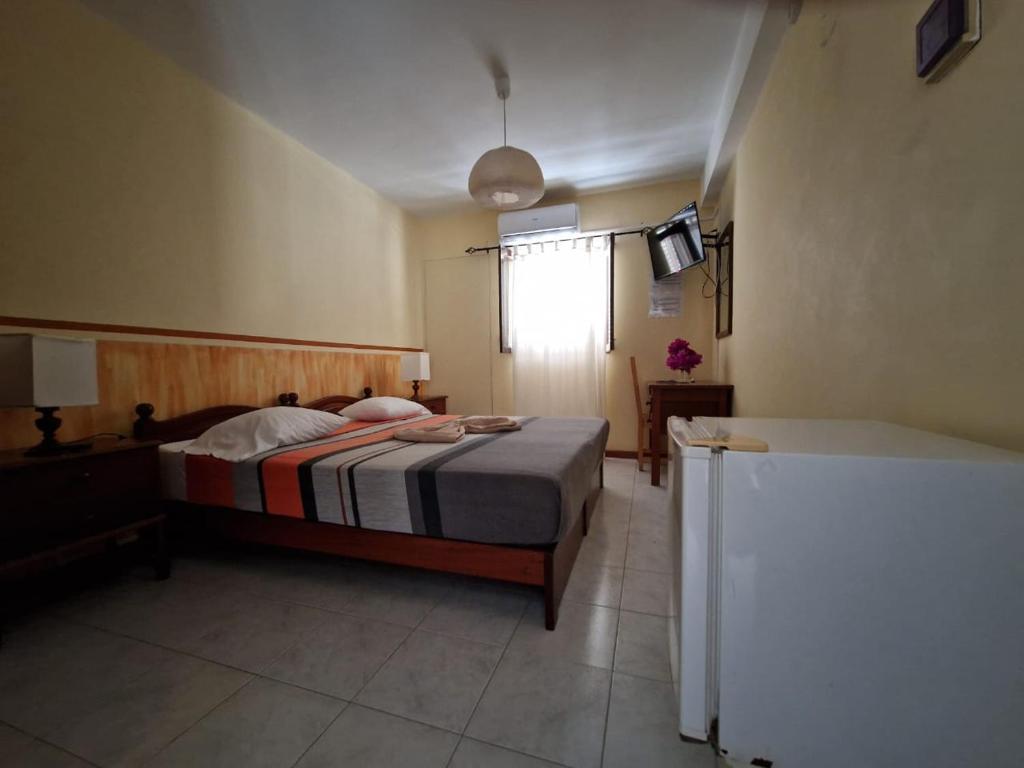 Postel nebo postele na pokoji v ubytování Residencial Raiar