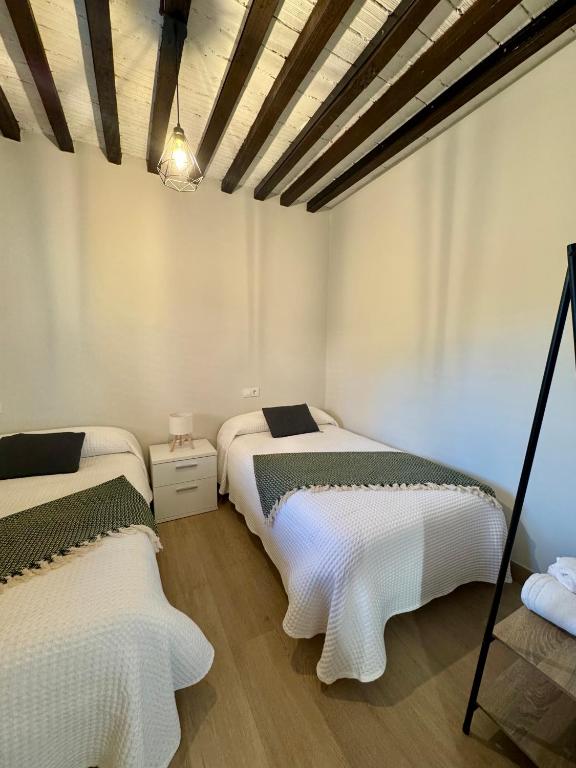 Postel nebo postele na pokoji v ubytování Casa Cuartel