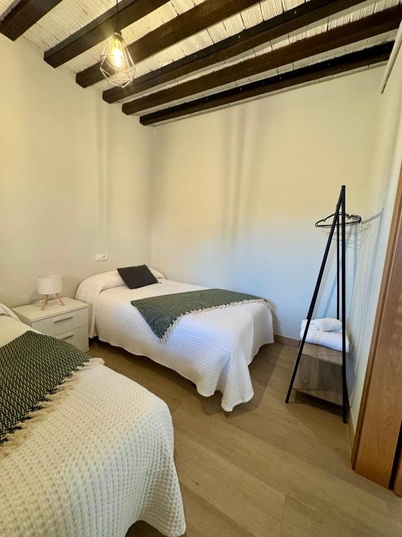 Postel nebo postele na pokoji v ubytování Casa Cuartel