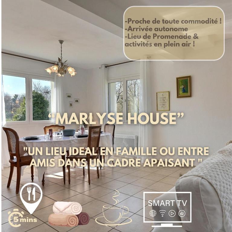 un magazine publicitaire pour une maison de luxe avec une table et des chaises dans l'établissement Marlyse House, à Habsheim