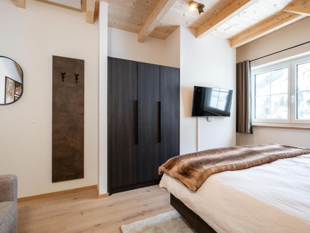 Postel nebo postele na pokoji v ubytování Edelweiss Lodge