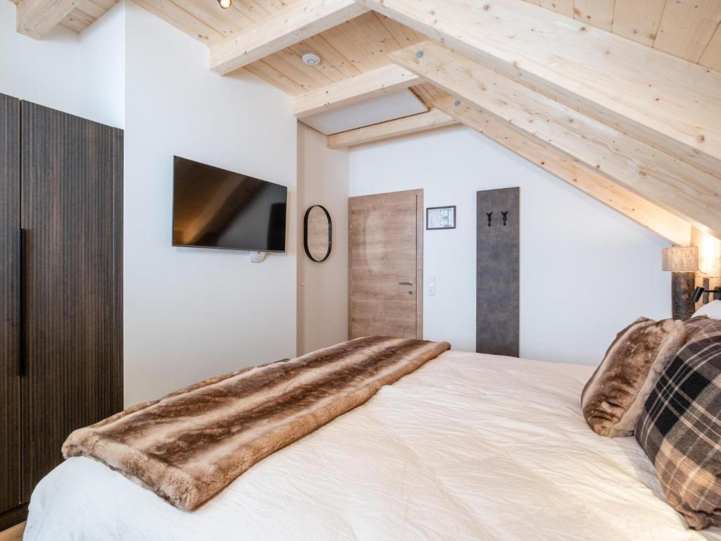 Postel nebo postele na pokoji v ubytování Edelweiss Lodge