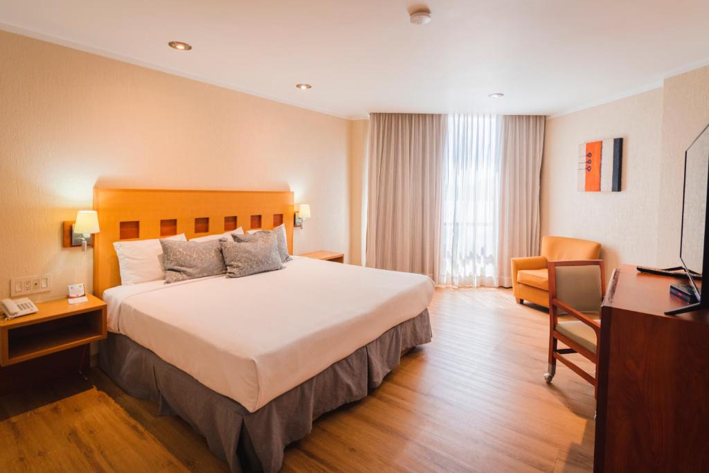 Postel nebo postele na pokoji v ubytování Hotel Mirabel