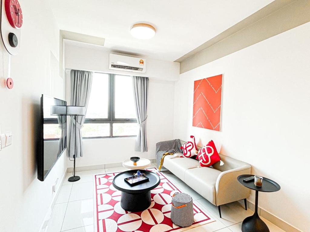 a living room with a couch and a table at Weekly Monthly Stay - Subang Jaya Edumetro SEGI Atira in Subang Jaya
