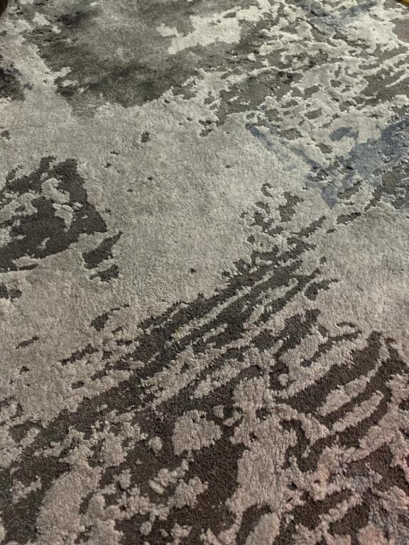 a rug on the floor with a pattern on it at Maison Dar TMMS in Khenifra