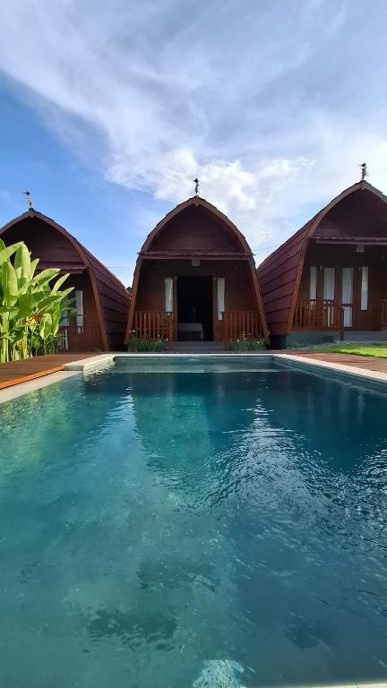 Πισίνα στο ή κοντά στο Amrita Jaya Guesthouse Kerobokan