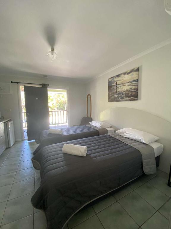 Postel nebo postele na pokoji v ubytování Agnes Palms Motel
