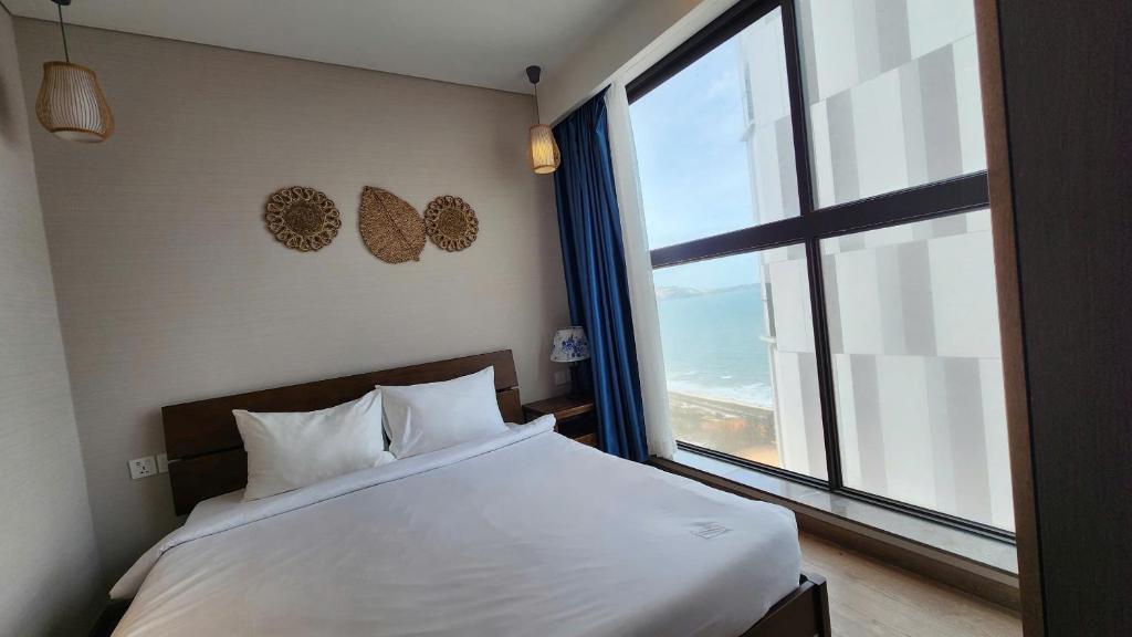 Postel nebo postele na pokoji v ubytování Mandala Chambay Tropic Bay