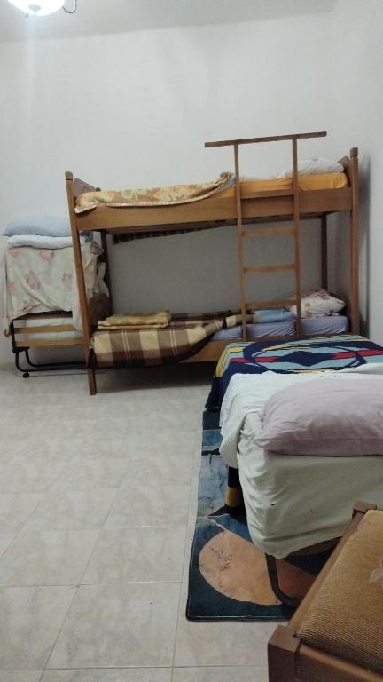 Postel nebo postele na pokoji v ubytování Backpackers Casa De Payaso