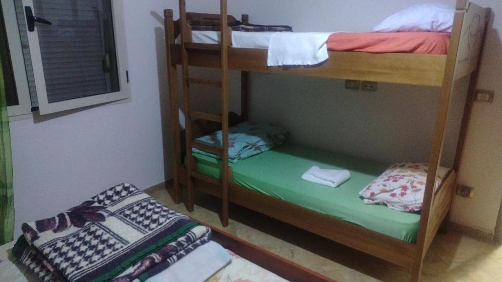 Postel nebo postele na pokoji v ubytování Backpackers Casa De Payaso