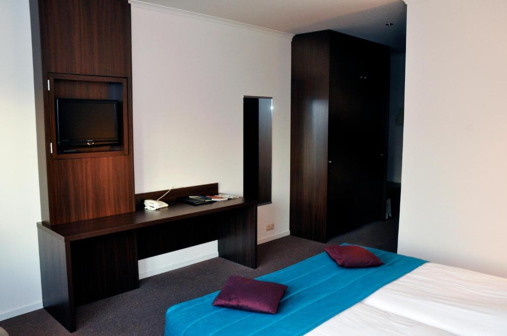 Postel nebo postele na pokoji v ubytování Hotel Het Landhuis