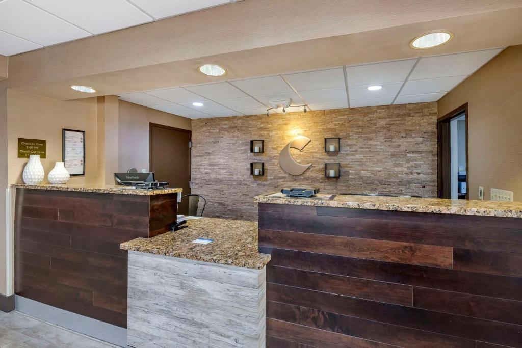 a lobby with a reception desk in a building at City Express by Marriott Yulee in Yulee