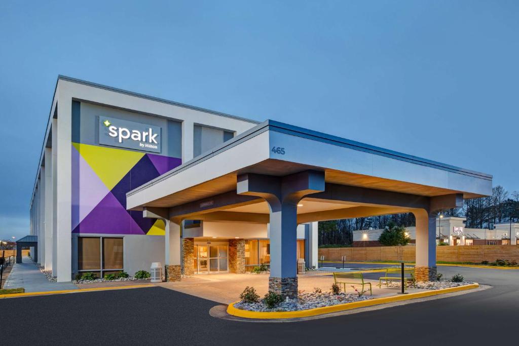 a large building with a park sign on it at Spark By Hilton Jackson Ridgeland in Jackson