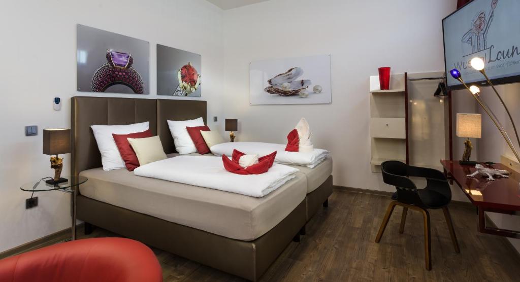 Postel nebo postele na pokoji v ubytování Wuschl Lounge