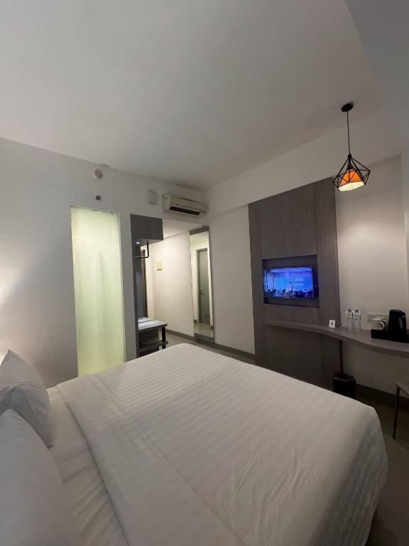 Postel nebo postele na pokoji v ubytování Laska Hotel Subang