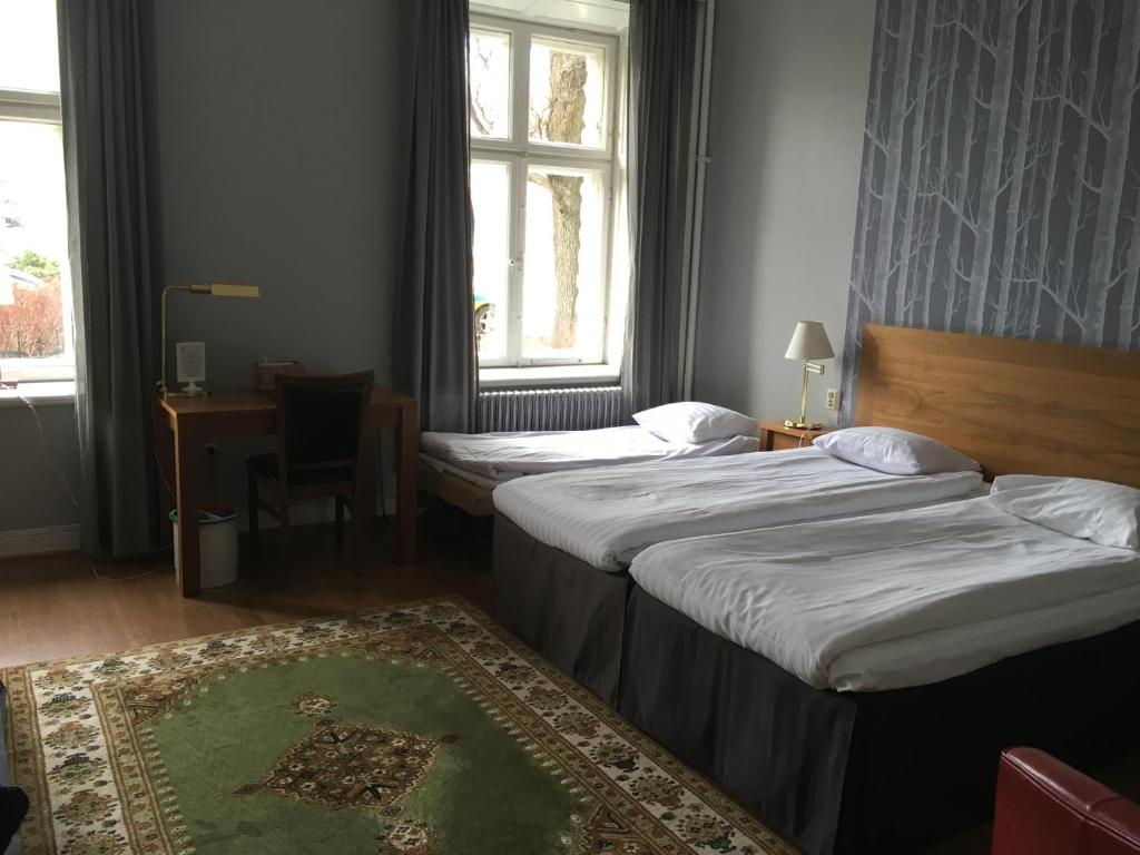 Postel nebo postele na pokoji v ubytování First Hotel City Eskilstuna
