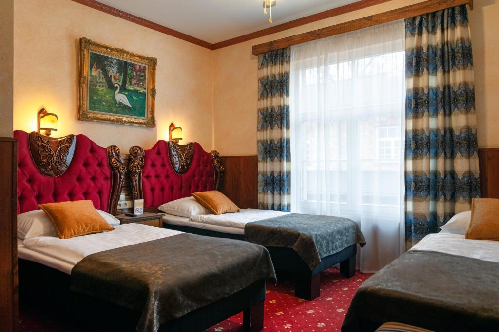 Voodi või voodid majutusasutuse Hansa Hotel toas