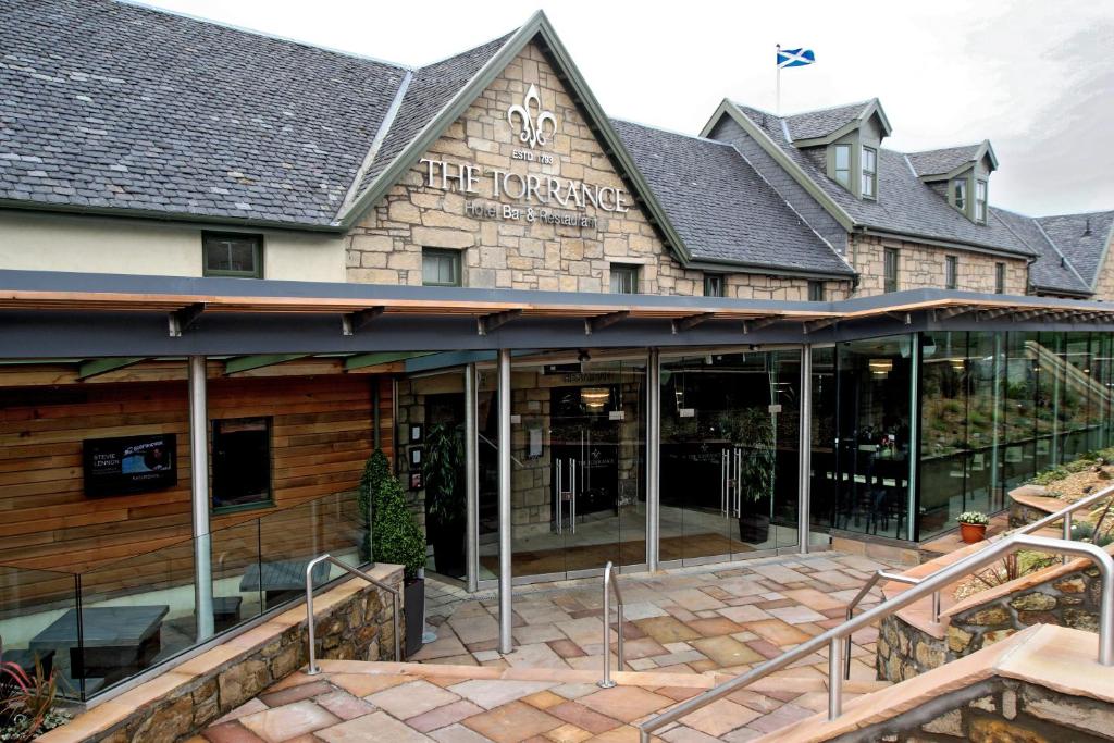 an exterior view of the front of a building at The Torrance Hotel in East Kilbride