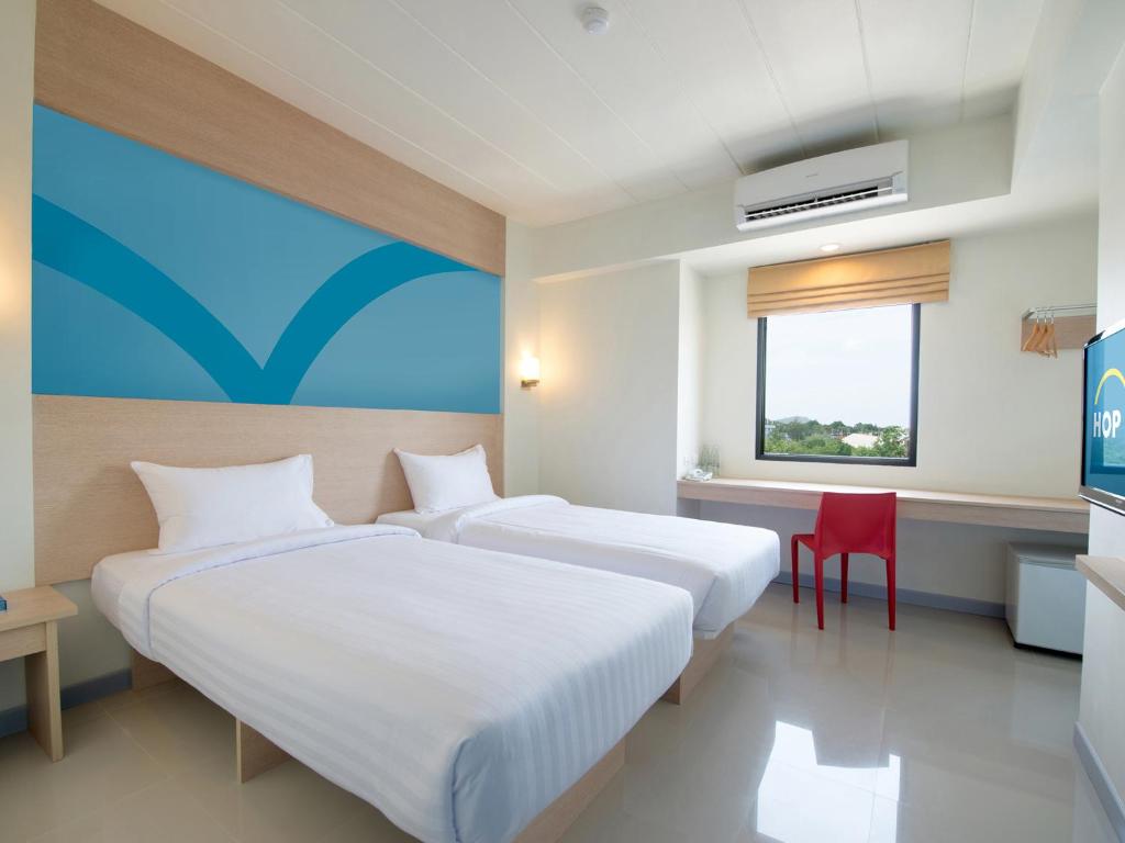 Postel nebo postele na pokoji v ubytování HOP INN Krabi Building B