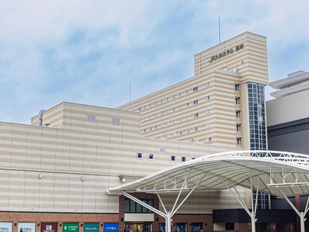 a large building with a sign that reads amazon at JR Kyushu Hotel Nagasaki in Nagasaki