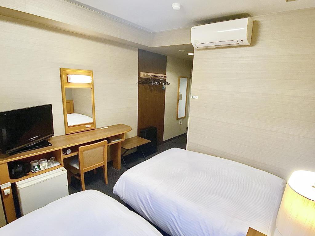 TV a/nebo společenská místnost v ubytování Hotel Route-Inn Shimada Yoshida Inter