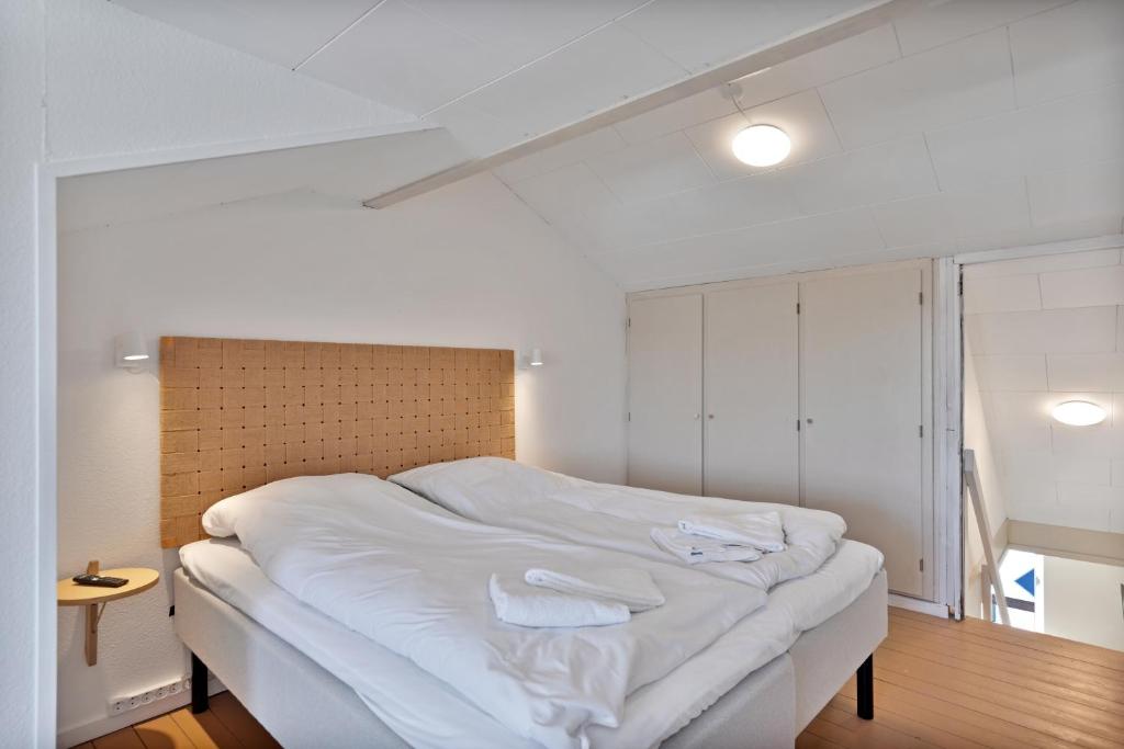 Postel nebo postele na pokoji v ubytování Hotel Klitbakken