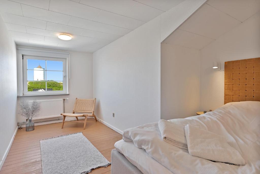 Postel nebo postele na pokoji v ubytování Hotel Klitbakken