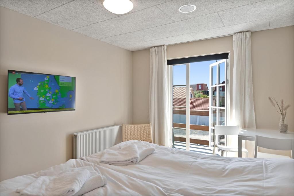 Postel nebo postele na pokoji v ubytování Hotel Klitbakken