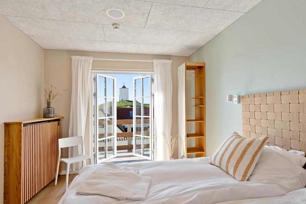 Postel nebo postele na pokoji v ubytování Hotel Klitbakken
