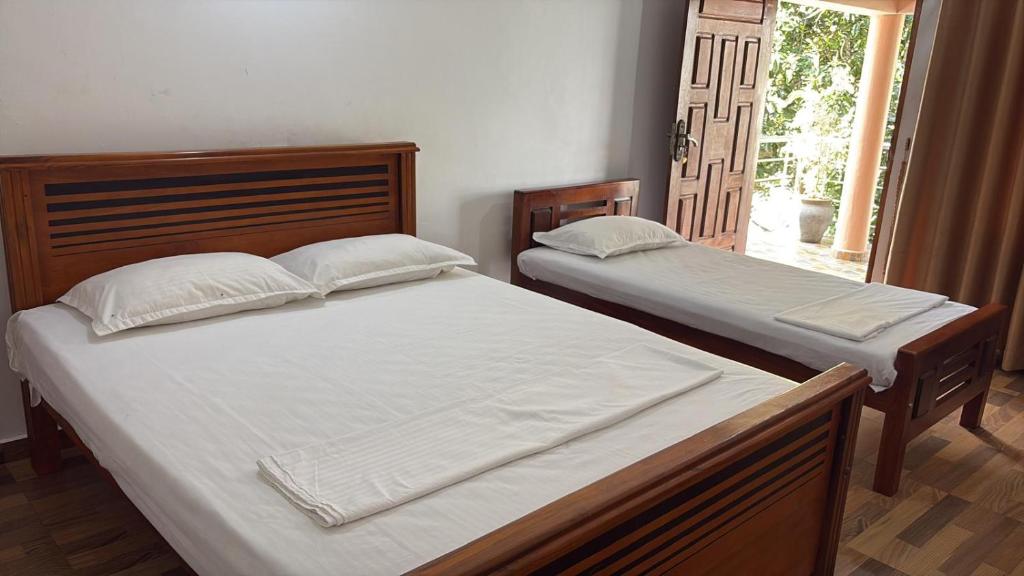Postel nebo postele na pokoji v ubytování Lagoon Breeze Resort