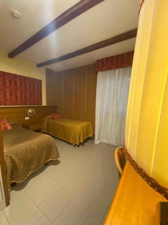 Postel nebo postele na pokoji v ubytování Hotel Sila