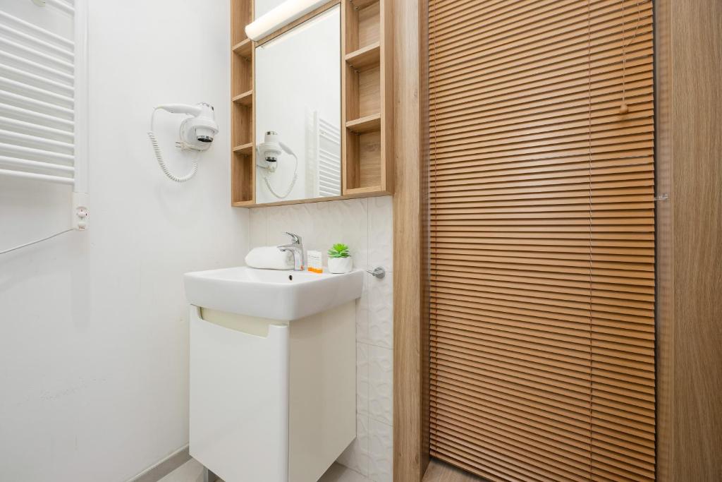 Koupelna v ubytování Business Studio Apartments Wolska by Noclegi Renters