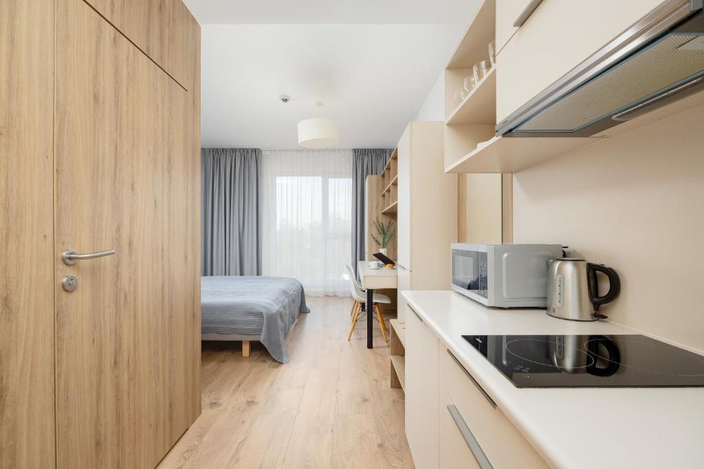 Kuchyň nebo kuchyňský kout v ubytování Business Studio Apartments Wolska by Noclegi Renters