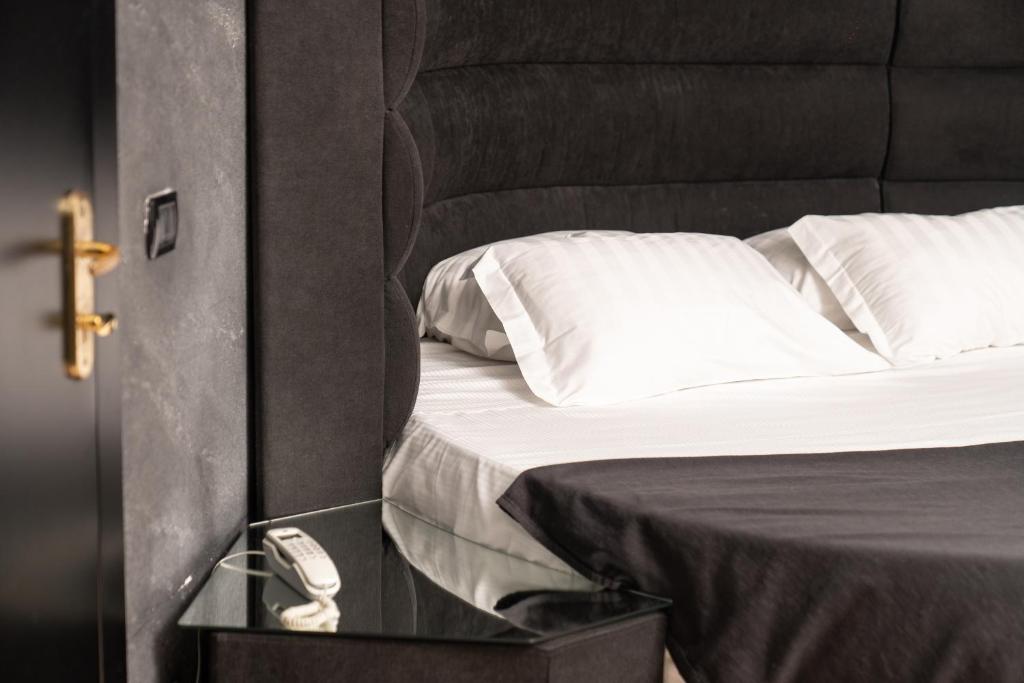 Postel nebo postele na pokoji v ubytování Hotel Paradiso