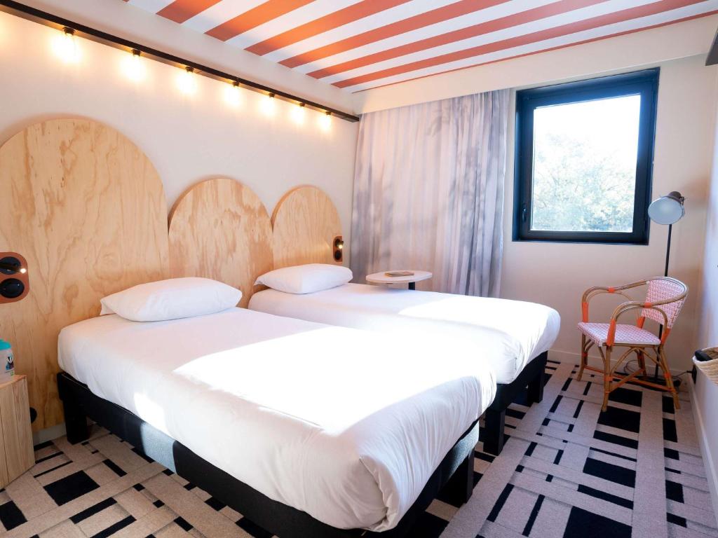 Letto o letti in una camera di ibis Styles Montauban