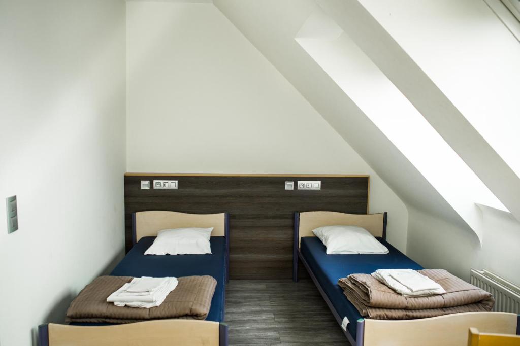 Postel nebo postele na pokoji v ubytování HI Brussels Generation Europe Hostel
