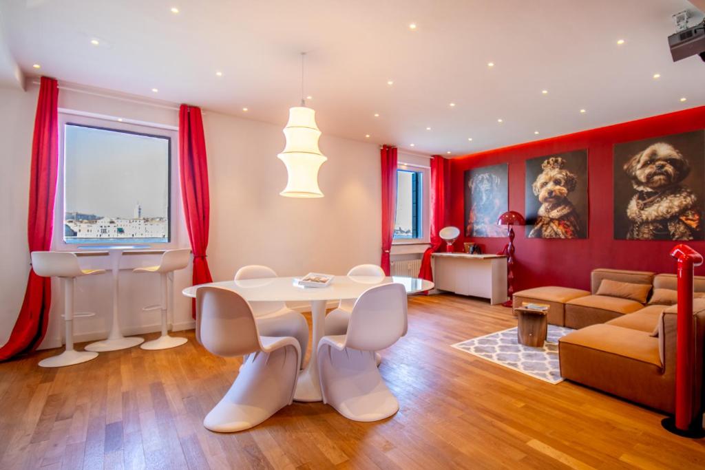 a living room with a table and a couch at 3 Windows on St Mark - Waterfront Apartment in Venice