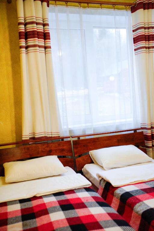 Postel nebo postele na pokoji v ubytování Готель Добрій